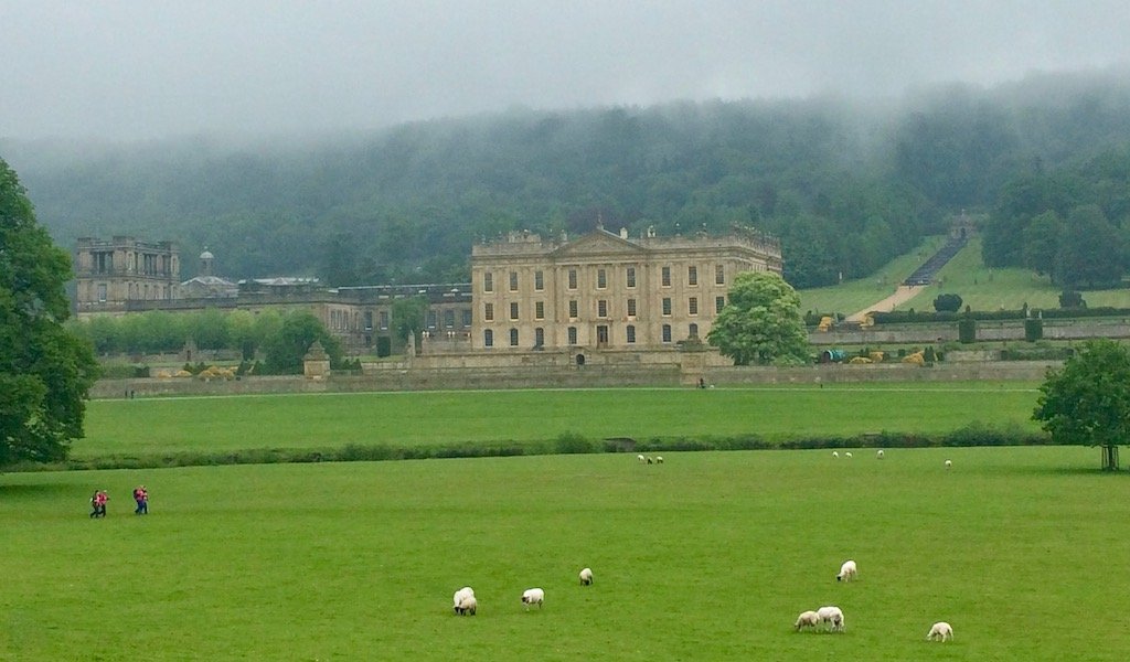 Chatsworth House across a green field