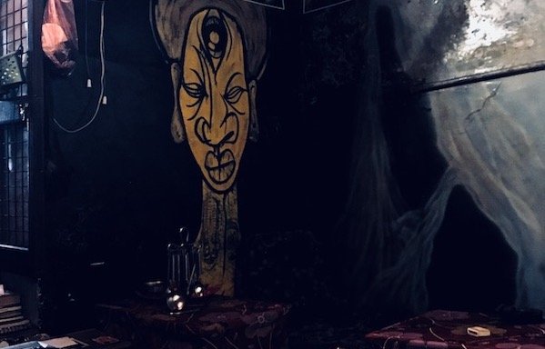 Travel story 'Underground Thought in Varanasi: Contrasts and Blasphemies' | Mural depicting the third eye on a wall of the Underground Cafe in Varanasi | controversial thoughts of a first visit to India