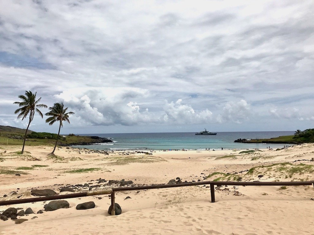 'Anakena: Where Easter Island Became Polynesian' travel article on slow travel blog Teja on the Horizon | Anakena beach under a cloudy sky | where the Rapa Nui Polynesians landed on Easter Island | Isla de Pascua, Chile