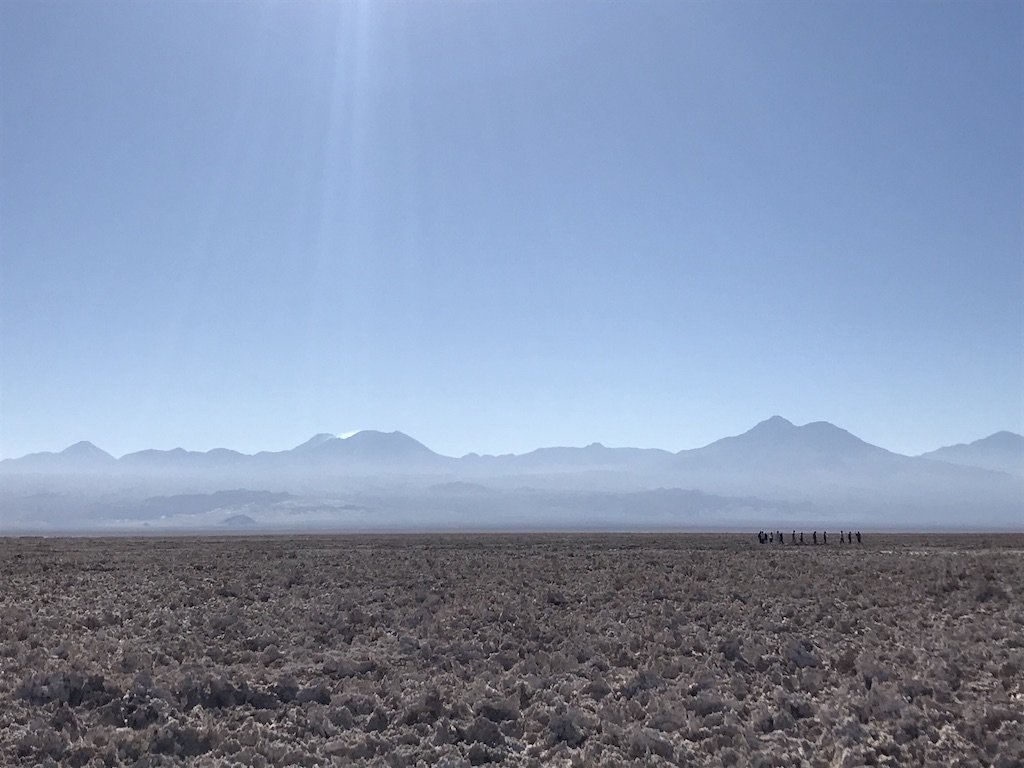 Essential Things I Wish I Knew About Choosing Tours in Atacama | guide article on travel blog Teja on the Horizon | salt flats of Atacama desert plateau with the Andes in the background