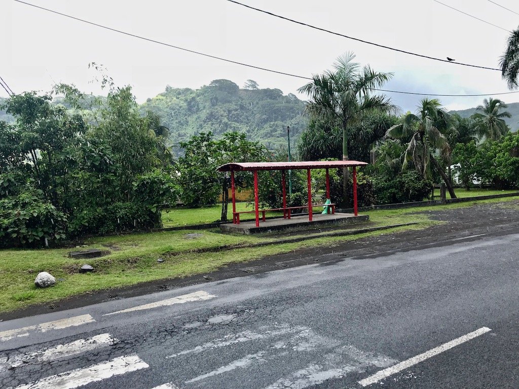 Bus stop in Tahiti against hill background