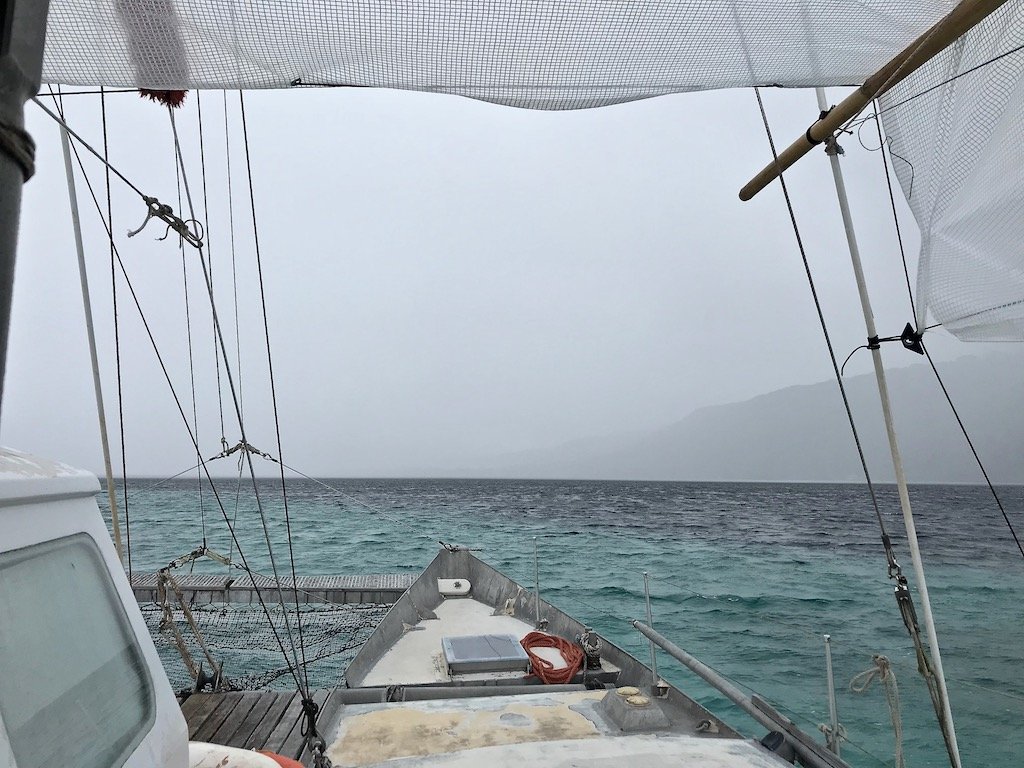 Incoming rain in Tahiti lagoon viewed from a catamaran