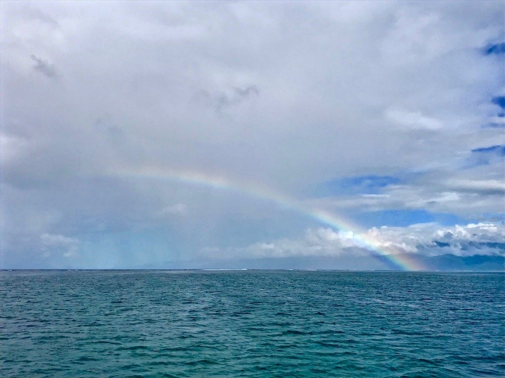 Rainbow on the horizon of the Pacific Ocean