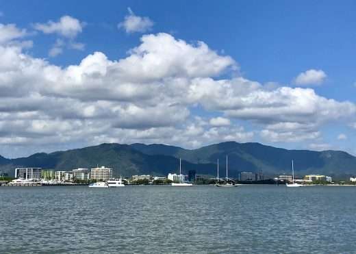 Coastline of Cairns with mountains behind as seen from the sea